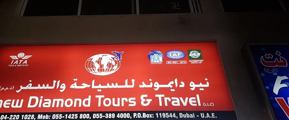 New Diamond Tours and Travel storefront sign in English and Arabic